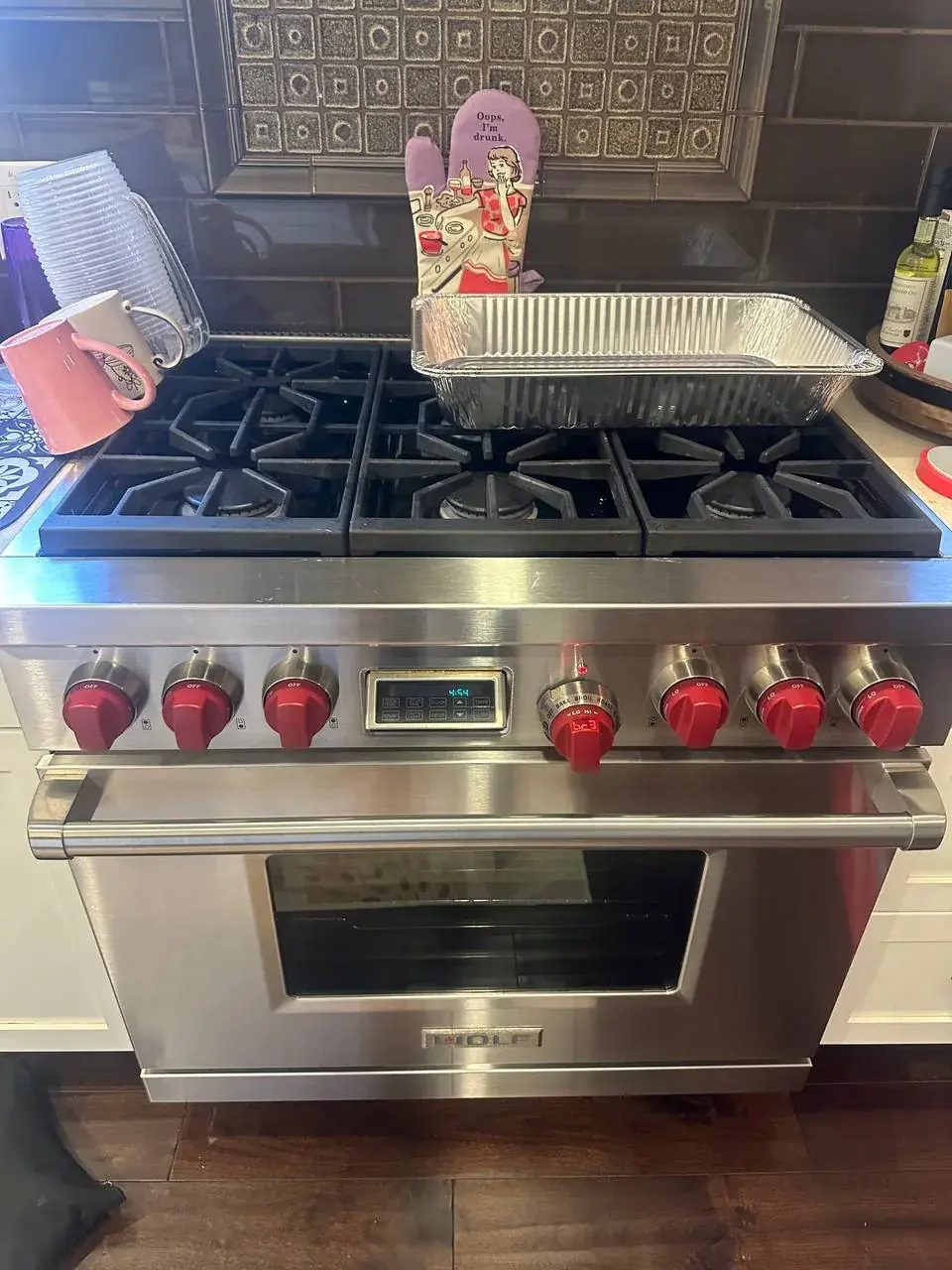 Professional range with red control knobs during service